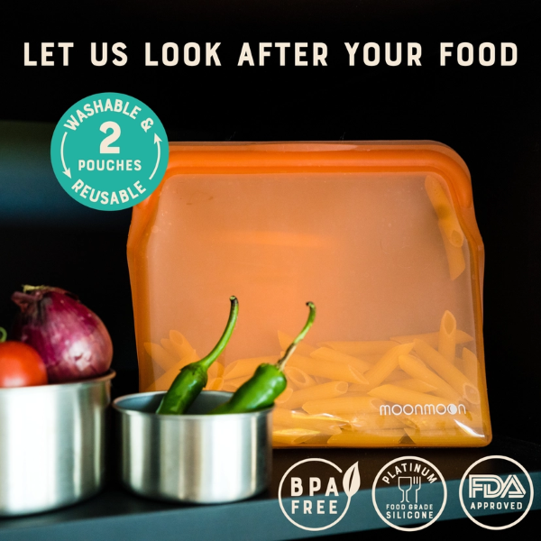 Reusable silicone food bags in large size shown with pasta inside next to veg in stainless steel tubs and text reading "BPA free platinum food grade silicone, FDA approved"