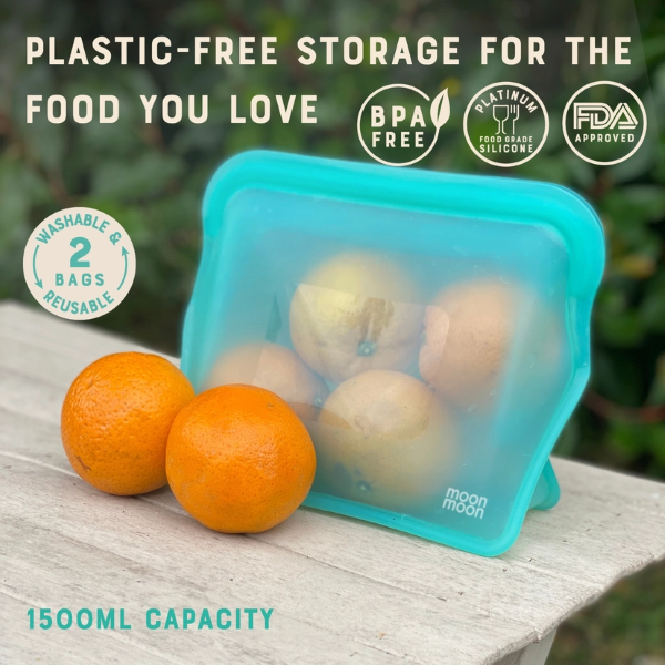 Reusable silicone food bags in xl size, with stand up functionality shown with oranges inside and text reading "Plastic-free storage for the food you love"