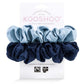 Plastic-free hair scrunchie set in True blue- one dark blue scrunchie and one light blue, shown with cardboard packaging