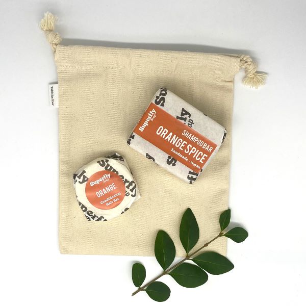 Superfly Soap shampoo and conditioner gift set in reusable cotton produce bag in orange spice