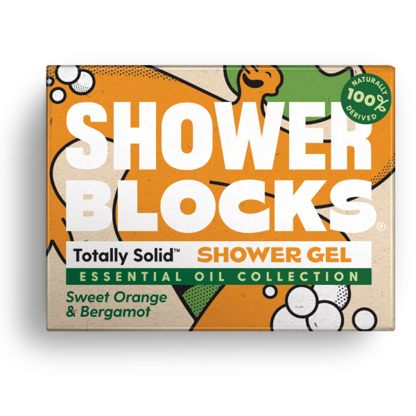 Totally solid shower gel bar in sweet orange and bergamot, shown in orange and green cardboard packaging
