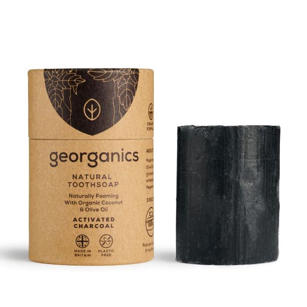 Black coloured activated charcoal Georganics toothsoap cardboard packaging shown with the toothsoap alongside