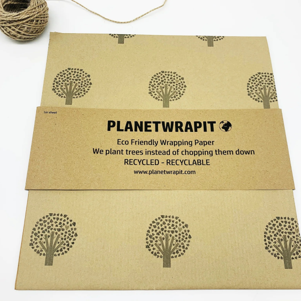 Handmade recycled wrapping paper in Tree of Life design (brown kraft paper background with hand-drawn style trees)