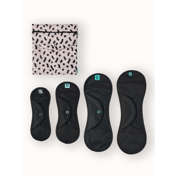 Nora reusable period pads try me pack showing the wet bag with the four sizes of black pads alongside