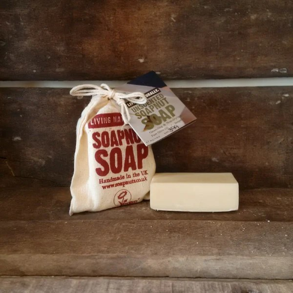 Unscented soapnut soap shown alongside cotton bag