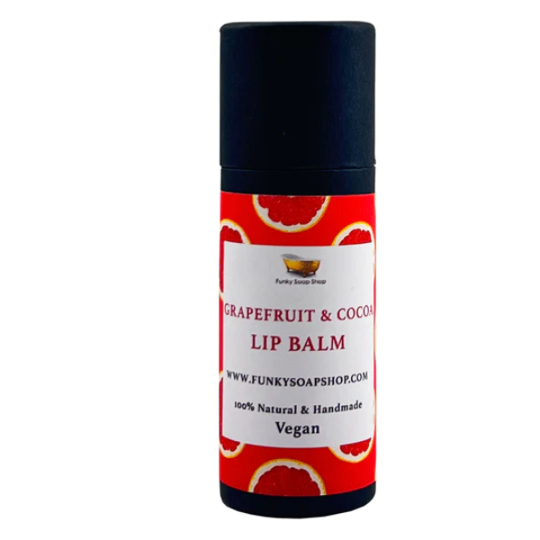 Vegan lip balm in grapefruit and cocoa butter, shown in biodegradable packaging