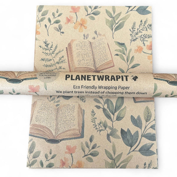 Kraft recycled wrapping paper with books and foliage alongside roll