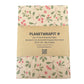 PlanetWrapIt recycled kraft wrapping paper in Christmas mistletoe (brown paper with printed red berries and green leaves) with PlanetWrapIt paper label