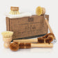 Jungle Culture's set of 6 bamboo and coconut fibre brushes sitting next to cardboard box packaging 