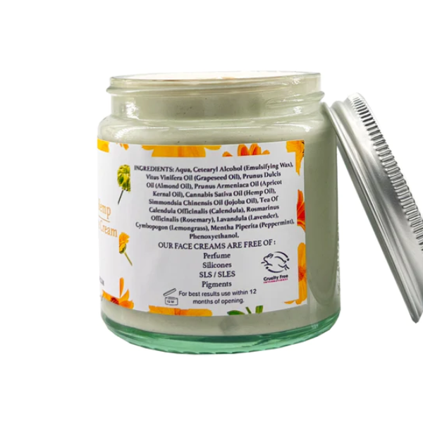 Face cream in glass jar with aluminium lid, Calendula and hemp, shown at side of jar with ingredients listed