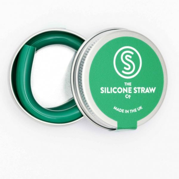 Silicone straw in green contained in small round tin shown with lid off and straw inside