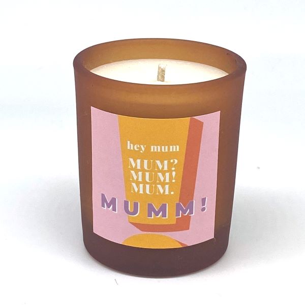 Clean burning candle in refillable orange glass jar with label reading "hey mum, Mum? Mum! Mum, Mumm!""