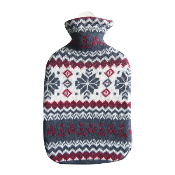 Hot water bottle in snowflake design (knitted cover with red, white and blue nordic-style pattern with snowflakes)