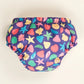 Reusable swim pants back view in Mussel Seashell design (navy blue background with colourful starfish, mussels and shells) 