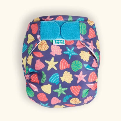Reusable swim nappy close up front view, in Mussel Seashells design (dark blue background with colourful star fish, mussels and shells)