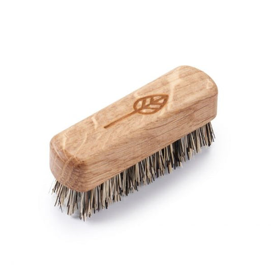 Wooden beard brush with tampico bristles with a leaf design carved into the wood
