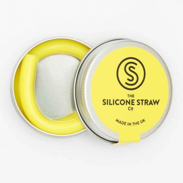Silicone straw in yellow contained in small round tin shown with lid off and straw inside