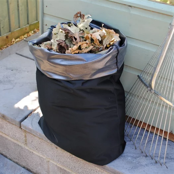 Reusable bin liner in use with leaves inside