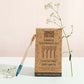 Bamboo toothbrush set of 4 cardboard packaging with one toothbrush shown