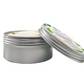 Eco-friendly vegan body butter in aluminium tin, shown open with cream inside, side view. Ginger and lime.