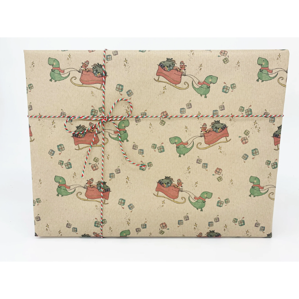 Eco-friendly Christmas wrapping paper Brown with colourful dinosaurs pulling Santa's sleigh, wrapping a parcel