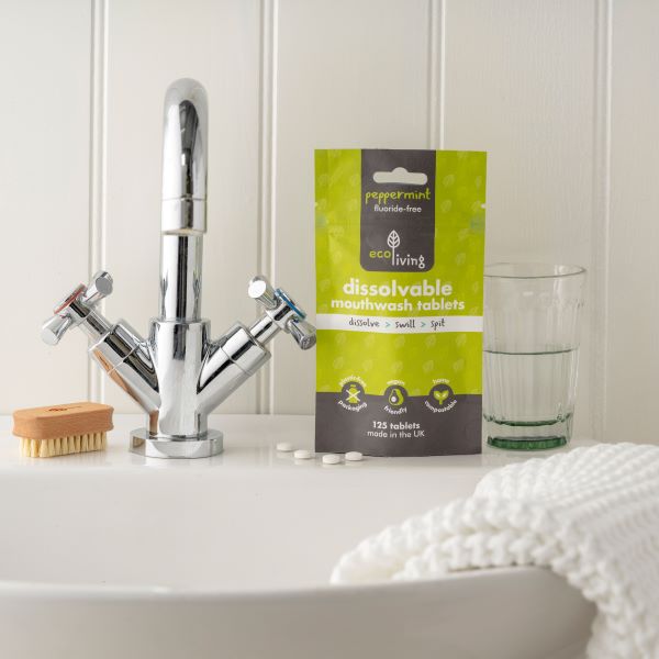 Eco-friendly dissolvable mouthwash tablets at a sink