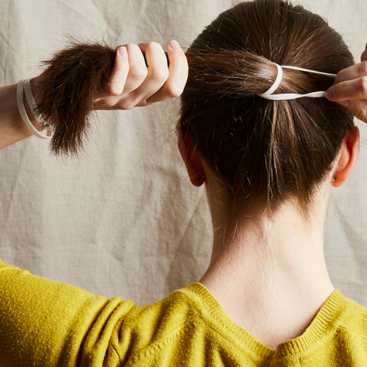 Plastic-free hair ties in use