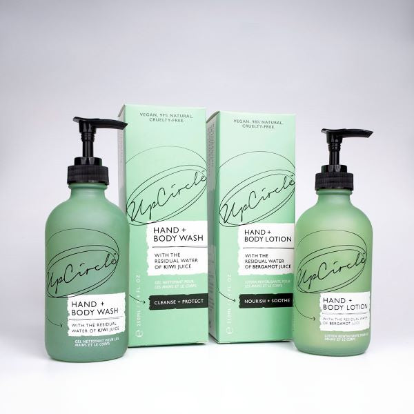 UpCircle hand and body wash alongside hand and body lotion, with cardboard packaging shown too