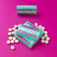 Mintastic sugar-free and vegan mints in spearmint - boxes with some mints scattered