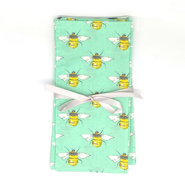 Reusable cotton napkins in Mint bee wrapped in ribbon
