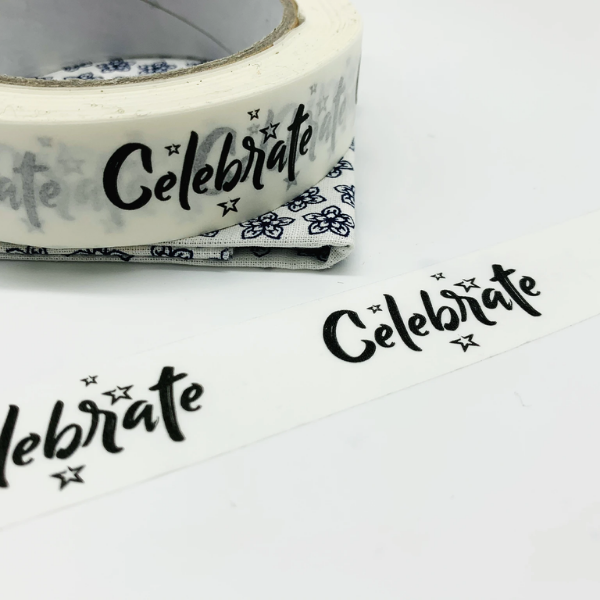 Eco-friendly paper tape white with "Celebrate" and a few stars in black