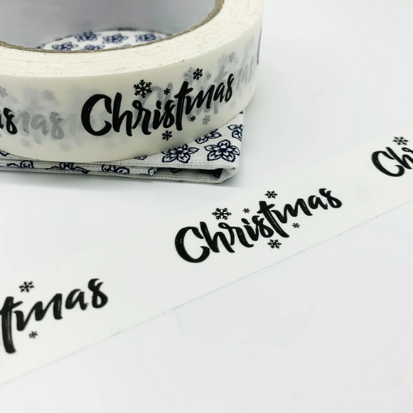 Eco-friendly paper tape White with black writing saying Christmas, with little black snowflakes