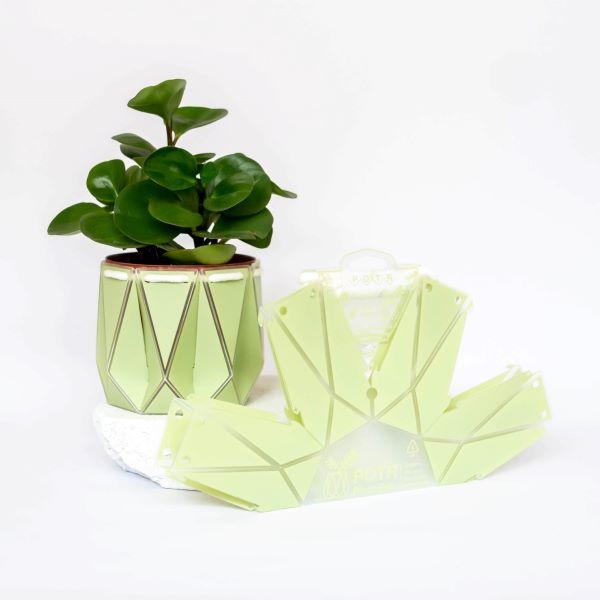 POTR self watering plant pot in sage showing it in original flat pack form too