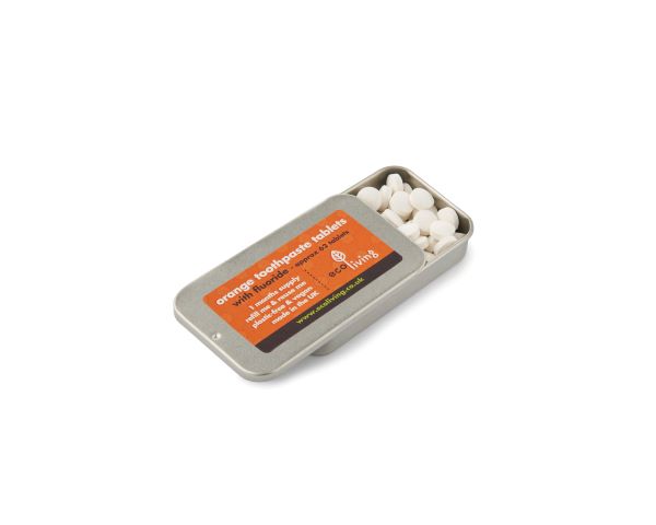 Eco-friendly toothpaste tablets orange in open tin