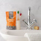 Eco-friendly toothpaste tablets Orange Fluoride-free tablets at sink